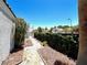 Landscaped side yard with a stone pathway, leading to the home entrance at 3329 Paragon Dr, Las Vegas, NV 89117