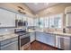 Modern kitchen with granite countertops and stainless steel appliances at 3766 Cape Solitude St, Las Vegas, NV 89147