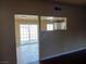 Living room with dark hardwood floors and a view into the kitchen at 4012 Mira Ln, Las Vegas, NV 89108