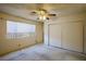 Bedroom with window, ceiling fan, and double door closet at 404 Vassar Ln, Las Vegas, NV 89107