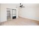 Spacious bedroom with light flooring and a barn door leading to the bathroom at 431 Casa Del Norte Dr, North Las Vegas, NV 89031