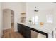 Contemporary kitchen with dark cabinets, quartz countertops, and a large sink at 431 Casa Del Norte Dr, North Las Vegas, NV 89031