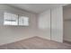 Bright bedroom featuring neutral walls and carpet at 453 Kings Ave, North Las Vegas, NV 89030