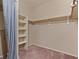 Walk-in closet with shelves and hanging rods at 5000 Red Rock St # 240, Las Vegas, NV 89118