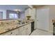 Spacious kitchen featuring granite countertops and black appliances at 5055 W Hacienda Ave # 1031, Las Vegas, NV 89118