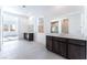 Modern bathroom with double vanity and large mirror at 5733 Granite Landing Ct, Las Vegas, NV 89131