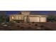 Stunning two-story home with landscaped yard and three-car garage at 5733 Granite Landing Ct, Las Vegas, NV 89131