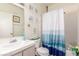 Clean bathroom with shower/tub combo and beachy decor at 6201 E Lake Mead Blvd # 216, Las Vegas, NV 89156