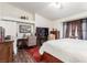 Main bedroom with king-size bed, and workspace at 6201 E Lake Mead Blvd # 216, Las Vegas, NV 89156