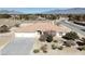 Single-story home with three-car garage and mountain backdrop at 720 Florida St, Pahrump, NV 89048