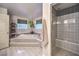 Elegant bathroom with a large soaking tub and walk-in shower at 8635 W Cougar Ave, Las Vegas, NV 89148