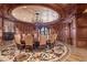 Formal dining room with a large round table and intricate flooring at 9101 Alta Dr # 1406, Las Vegas, NV 89145