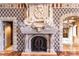 Ornate fireplace with detailed stonework and carvings at 9101 Alta Dr # 1406, Las Vegas, NV 89145