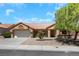 Single-story home with desert landscaping and two-car garage at 9524 Sundial Dr, Las Vegas, NV 89134