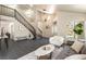 Open and airy entryway featuring a modern staircase and tile flooring at 9709 Quail Springs Ct, Las Vegas, NV 89117