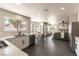 Modern kitchen with white cabinets, quartz countertops, and stainless steel appliances at 9709 Quail Springs Ct, Las Vegas, NV 89117