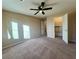 Bright bedroom with ceiling fan and walk-in closet at 9886 Gold Coin Ct, Las Vegas, NV 89141