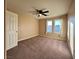 Spacious bedroom with neutral decor and ceiling fan at 9886 Gold Coin Ct, Las Vegas, NV 89141