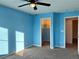 Bright bedroom with ceiling fan and spacious closet at 9886 Gold Coin Ct, Las Vegas, NV 89141