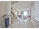 Modern entryway with gray tile floors and a staircase at 109 Short Ruff Way, Las Vegas, NV 89148