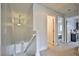 Upstairs hallway with doors to bedrooms and laundry room at 109 Short Ruff Way, Las Vegas, NV 89148