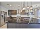 Modern kitchen with dark cabinetry and marble countertops at 109 Short Ruff Way, Las Vegas, NV 89148