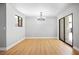 Bright dining room with light gray walls, hardwood floors, and a chandelier at 1571 Sundown Dr, Henderson, NV 89002