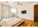 Modern bedroom with hardwood floors and a ceiling fan at 17 Cedar Chase Dr, Henderson, NV 89052