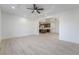 Open living room with wood-look floors and view into kitchen at 170 Story Ave, Pahrump, NV 89060