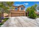 Attractive two-story house with a three-car garage at 1732 Double Arch Ct, Las Vegas, NV 89128