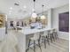 Spacious kitchen with island, modern cabinetry, and quartz countertops at 1928 Oliver Springs St, Henderson, NV 89052