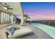 Covered patio with pool and sunset view at 1928 Oliver Springs St, Henderson, NV 89052