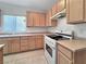 Kitchen features light wood cabinets and white appliances at 2133 King Mesa Dr, Henderson, NV 89012