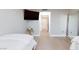 Bedroom with a large TV, full-length mirror, and light floors at 2747 Paradise Rd # 1502, Las Vegas, NV 89109