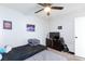 Bright bedroom with two twin beds, dresser, and ceiling fan at 2817 Mardi Gras Ln, North Las Vegas, NV 89030