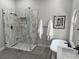 Spa-like bathroom with soaking tub, walk-in shower, and modern finishes at 3063 Evening Mist Ave, Henderson, NV 89052