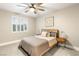 Comfortable bedroom with a queen-size bed and window seat at 3427 Alpine Lily Dr, Las Vegas, NV 89141