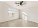 Bright bedroom with ceiling fan and arched window at 3837 Willowview Ct, Las Vegas, NV 89147