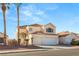 Two-story house with three-car garage and palm trees at 3837 Willowview Ct, Las Vegas, NV 89147