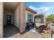 Brick paved porch with wicker seating and colorful rug at 421 Point Sur Ave, Las Vegas, NV 89138