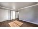 Bright bedroom with wood-look tile floors and double door closet at 5299 Emelita St, Las Vegas, NV 89122