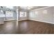 Spacious living room with wood-look floors and ceiling fan at 5299 Emelita St, Las Vegas, NV 89122