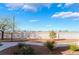 Landscaped backyard with a winding pathway at 5415 W Harmon Ave # 1051, Las Vegas, NV 89103