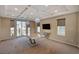 Elegant dining room with a marble table, chandelier and large windows at 6257 Olde Lockford Ct, Las Vegas, NV 89139