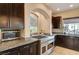 Modern kitchen with stainless steel appliances and granite countertops at 6257 Olde Lockford Ct, Las Vegas, NV 89139