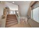 Staircase with neutral carpeting and tile flooring at 6257 Olde Lockford Ct, Las Vegas, NV 89139