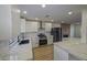 Modern kitchen with white cabinets and quartz counters at 8637 Tivoli Ct, Las Vegas, NV 89117