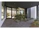 Glass entry door opens to a light-filled interior with courtyard and landscaping at 1485 Foothills Village Dr, Henderson, NV 89012