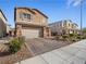 Two-story house with a brick driveway and landscaping at 1640 Karst Pond Ave, North Las Vegas, NV 89084