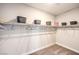 Well-organized closet with shelves and hanging rods at 1917 Lewis Bay Ave # Lot 22, North Las Vegas, NV 89084